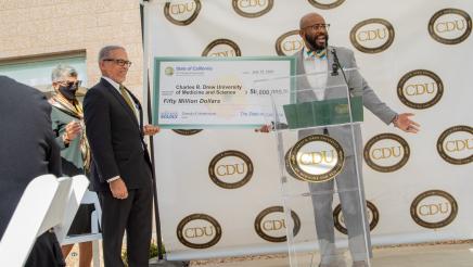 Asm. Gipson presenting large check