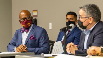 Asm. Gipson confers with panelist