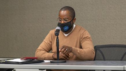 Panelist at microphone, speaking