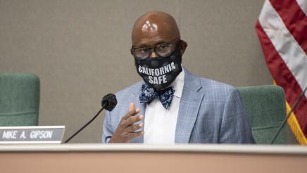 Asm. Gipson at microphone, speaking