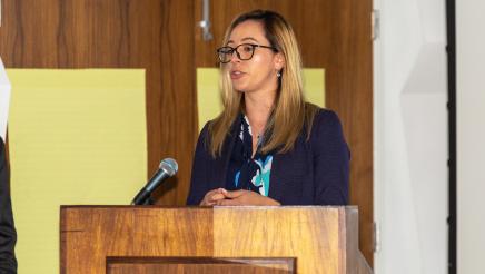 Woman at podium, speaking