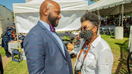 Asm. Gipson speaking with Art Center Director Rosie Lee Hooks