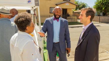 Asm. Gipson speaking with Rosie Lee Hooks and attendee