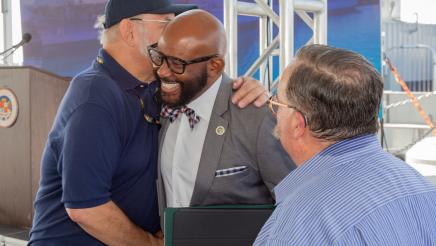 Asm. Gipson sharing congratulations with former service member