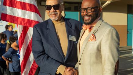 Asm. Gipson shaking hands with board member Peter Gravett
