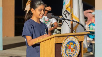 Child at podium, speaking