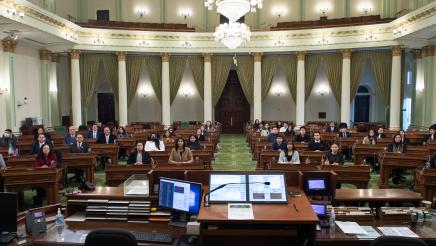 The Light of the World Church members seated throughout the Assembly Chamber