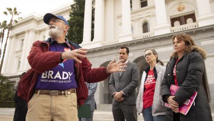 Brady Foundation representative speaking and gesturing to one side