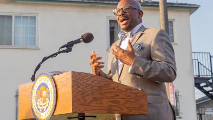 Asm. Gipson at podium, speaking
