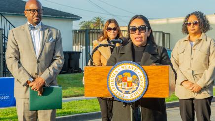 Asm. Gipson listening on as guest speaker speaks