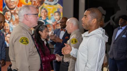 Sheriffs and other attendees interacting