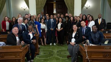 Rep. Justin Jones with Asm. Gipson and multiple assemblymembers