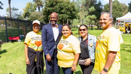 Asm. Gipson posing with SBCC staffers