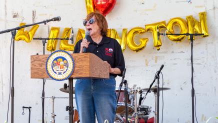 SBCC representative at podium, speaking