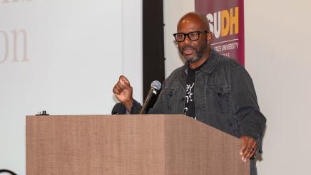 Asm. Gipson at podium, speaking