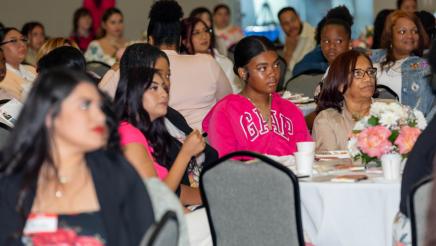 Audience members listening attentively