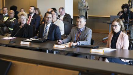 Danny Wan (Port of Oakland), seated with panel of other witnesses, speaking