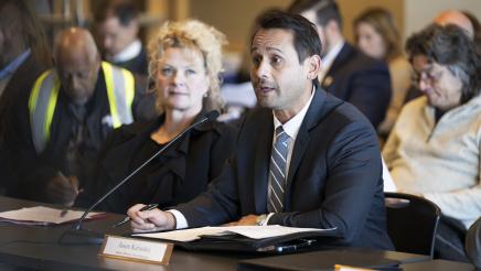 Jason Katindoy (Port of Stockton), seated with Kristine Zortman at left, speaking