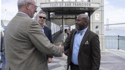 Asm. Gipson is greeted after exiting boat