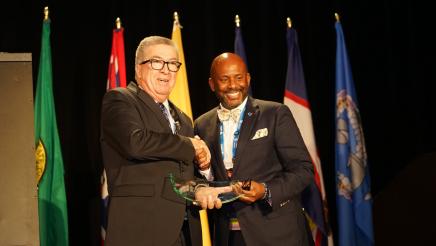 Asm. Gipson presenting an award