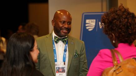 Asm. Gipson chatting with colleagues 