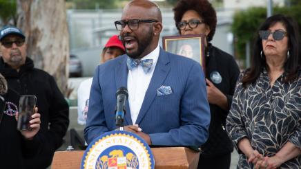 Asm. Gipson at podium, speaking