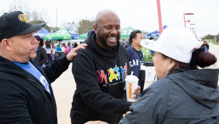 Asm. Gipson greeting two participants