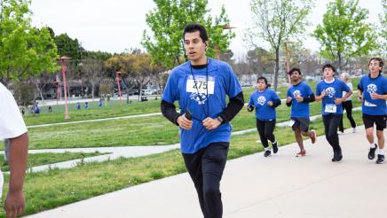 Participants running along path