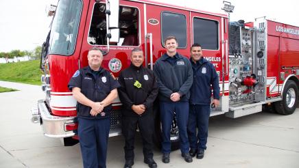 Firefighters in front of fire truck