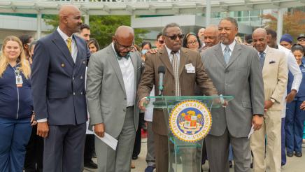 Asm. Gipson, hospital pastor, Sen Bradford and hospital staff in prayer