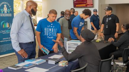 Fathers being provided infomation at resource table