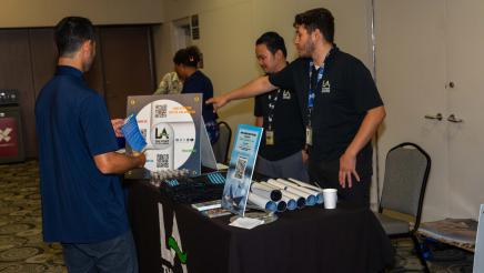 Father at resource table, being provided with information and materials