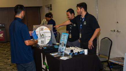 Father at resource table, being provided with information and materials