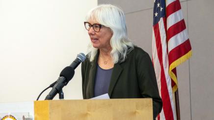 Guest speaker at podium, speaking