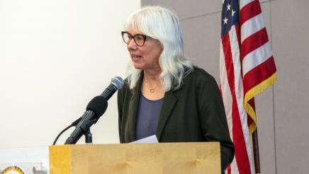 Guest speaker at podium, speaking