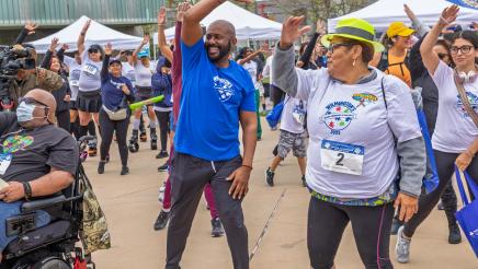 Asm. Gipson exercising with run participants