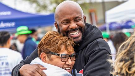 Asm. Gipson and constituent hugging