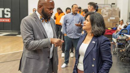 Asm. Gipson speaking with fellow honoree