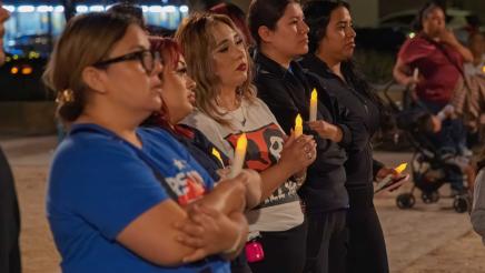Group of participants holding candles