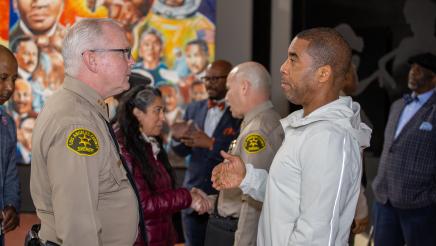 Sheriffs and other attendees interacting
