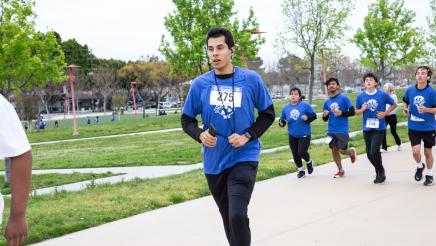 Participants running along path